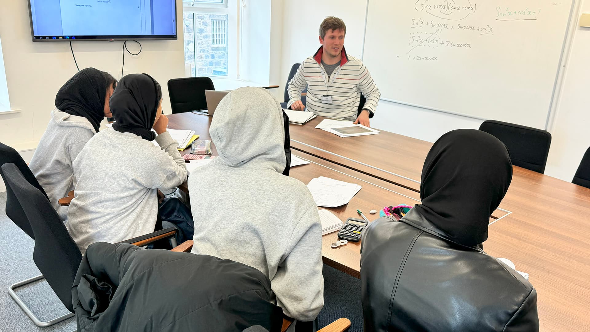 Teacher demonstrating a subject in class